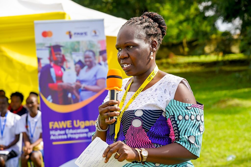 Susan Opok Tumusiime, FAWE Uganda Executive Director, giving closing remarks at the Extended Orientation Programme bursary awarding ceremony at UTC Elgon, Mbale